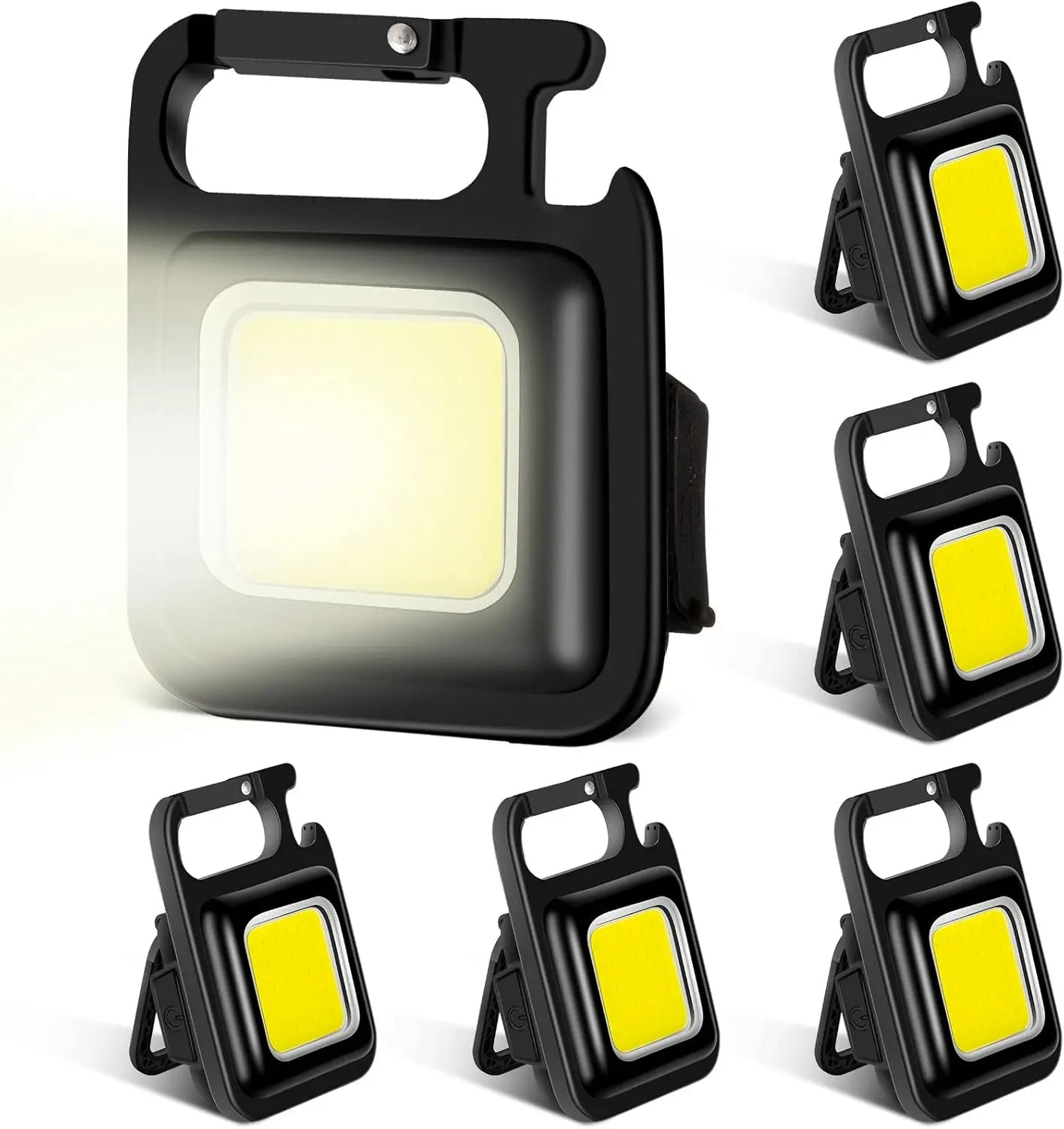 Set of six black portable LED work lights with yellow lenses on a white background